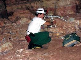 Cave researcher with instruments